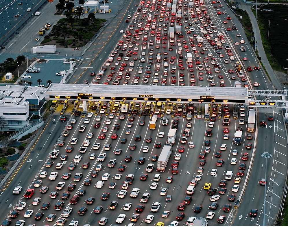 Traffic congestion at highway toll plaza.